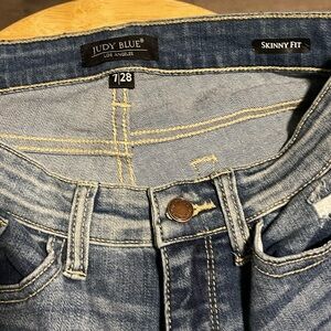 Judy blue jeans. Size 7 jeans have camo print under the holes. Like new